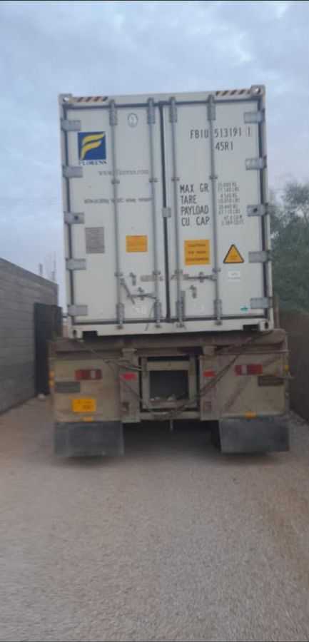 Refrigerated container on a road trailer