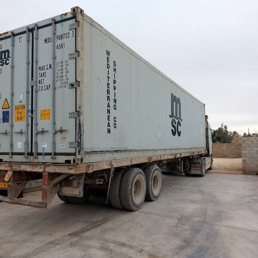 Sea container on a truck in the yard