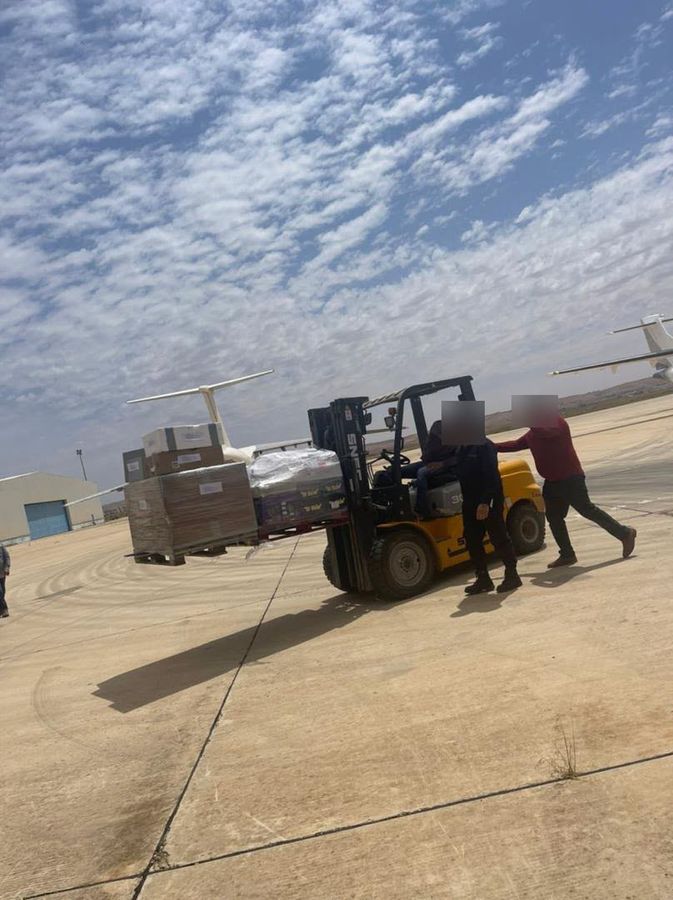 Forklift handling air cargo on the apron