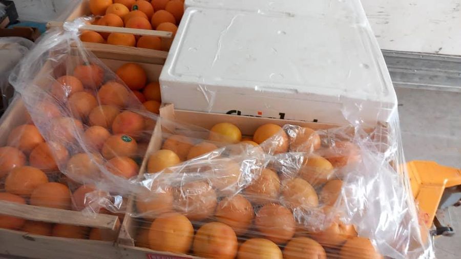 Fresh oranges packed in crates