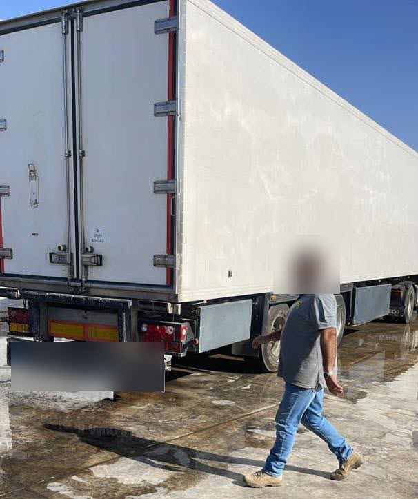 Driver checking the refrigerated trailer