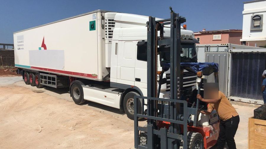 Unloading a refrigerated truck by forklift